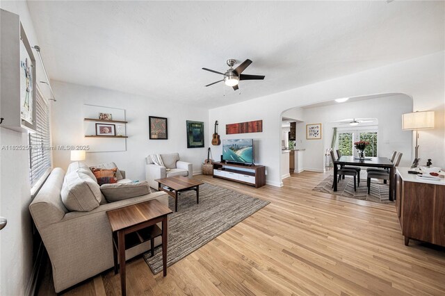 443 SW 18th Rd, Miami, FL 33129 - living room featuring ceiling fan, arched walkways, and light wood-type flooring