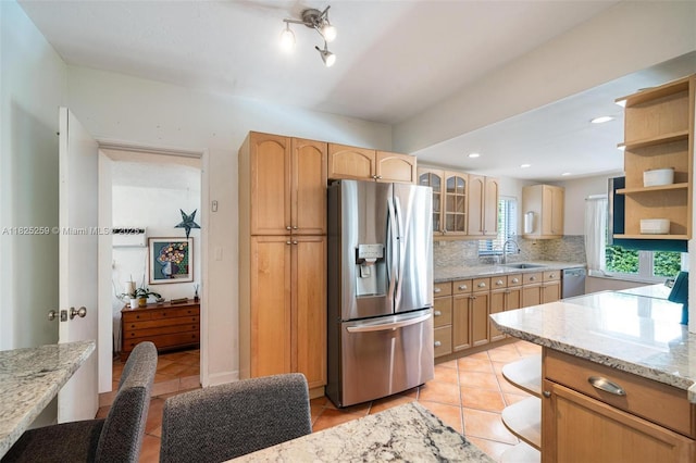 443 SW 18th Rd, Miami, FL 33129 - kitchen with stainless steel appliances, open shelves, light tile patterned flooring, and glass insert cabinets