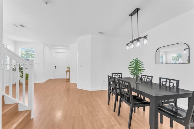 8081 NW 107th Ct, Doral, FL 33178 - dining area with light wood finished floors and stairs