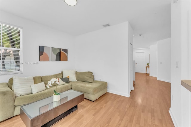 8081 NW 107th Ct, Doral, FL 33178 - living area featuring light wood finished floors and baseboards