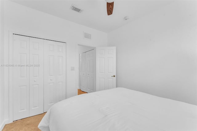 8081 NW 107th Ct, Doral, FL 33178 - bedroom featuring light colored carpet, ceiling fan, and a closet