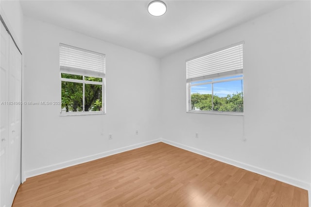 8081 NW 107th Ct, Doral, FL 33178 - empty room featuring healthy amount of natural light and light wood-type flooring