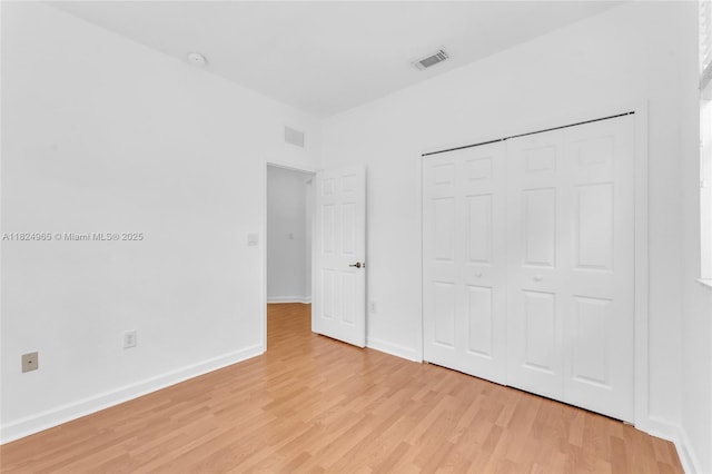 8081 NW 107th Ct, Doral, FL 33178 - unfurnished bedroom featuring light wood-style floors and a closet