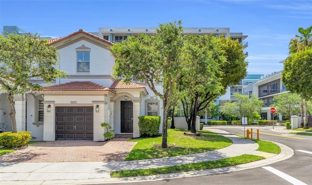 8081 NW 107th Ct, Doral, FL 33178 - view of property with stucco siding, a tiled roof, and decorative driveway