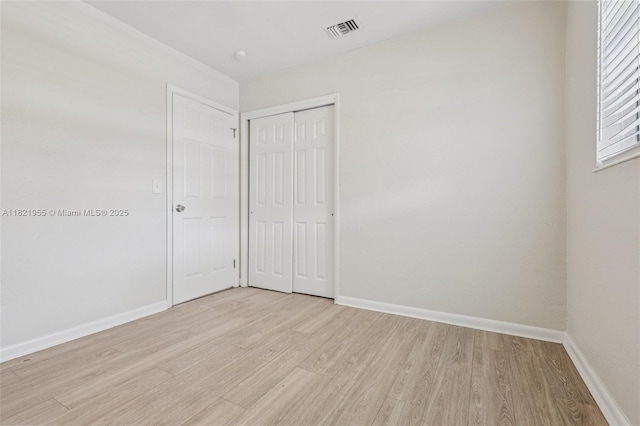 2817 SW 8th St, Fort Lauderdale, FL 33312 - unfurnished bedroom with light wood-type flooring and a closet