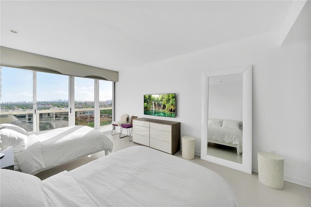 9601 Collins Ave Unit 809, Bal Harbour, FL 33154 - bedroom featuring finished concrete floors and baseboards