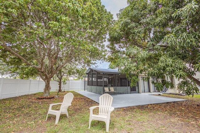 3420 NW 21st Ct, Coconut Creek, FL 33066 - fenced backyard with a patio and a sunroom