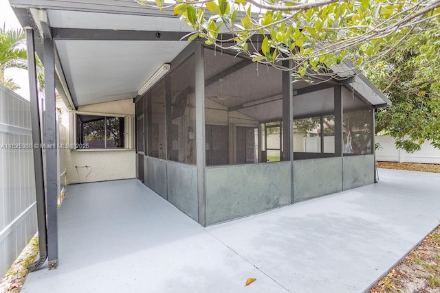 3420 NW 21st Ct, Coconut Creek, FL 33066 - view of property exterior featuring a sunroom and a patio area