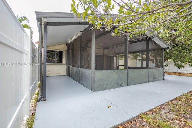 3420 NW 21st Ct, Coconut Creek, FL 33066 - view of side of home with a sunroom
