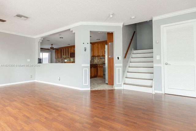 3420 NW 21st Ct, Coconut Creek, FL 33066 - unfurnished living room with ceiling fan, wood finished floors, stairs, ornamental molding, and a textured ceiling