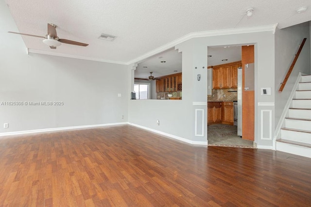 3420 NW 21st Ct, Coconut Creek, FL 33066 - unfurnished living room with ceiling fan, wood finished floors, stairs, ornamental molding, and a textured ceiling