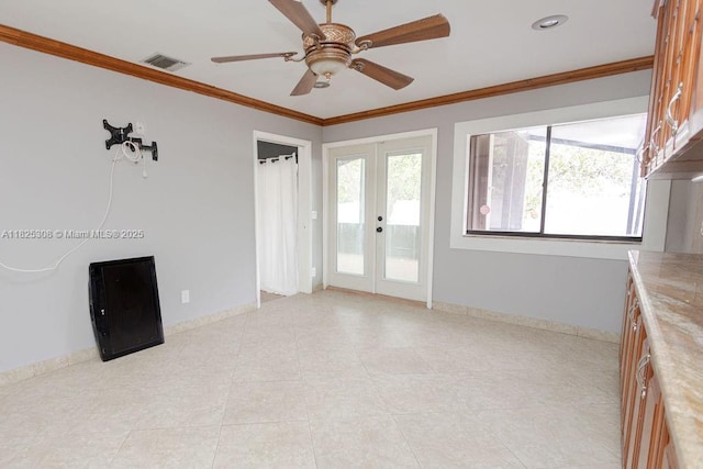 3420 NW 21st Ct, Coconut Creek, FL 33066 - spare room featuring ceiling fan, crown molding, and french doors