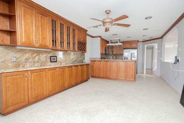 3420 NW 21st Ct, Coconut Creek, FL 33066 - kitchen with appliances with stainless steel finishes, ornamental molding, brown cabinets, ceiling fan, and decorative backsplash