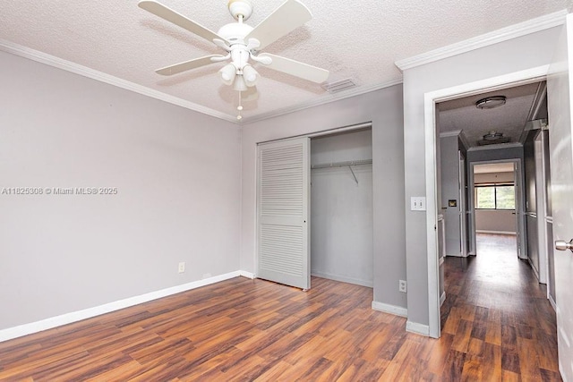 3420 NW 21st Ct, Coconut Creek, FL 33066 - unfurnished bedroom with dark wood finished floors, a textured ceiling, a closet, ornamental molding, and a ceiling fan