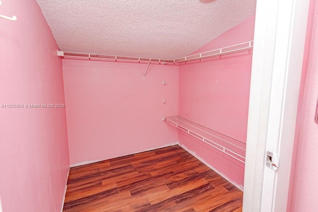 3420 NW 21st Ct, Coconut Creek, FL 33066 - spacious closet with wood finished floors and vaulted ceiling
