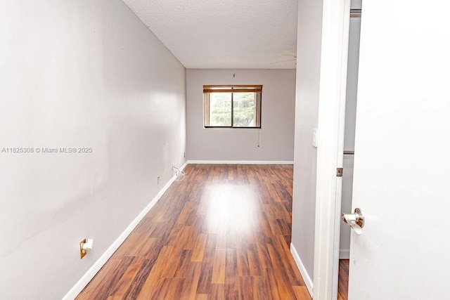 3420 NW 21st Ct, Coconut Creek, FL 33066 - unfurnished room with wood finished floors and a textured ceiling