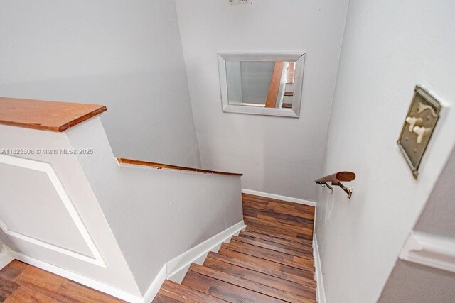 3420 NW 21st Ct, Coconut Creek, FL 33066 - stairs with wood finished floors and baseboards