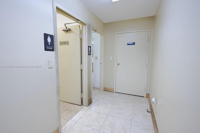 3420 NW 21st Ct, Coconut Creek, FL 33066 - hall with light tile patterned floors and baseboards