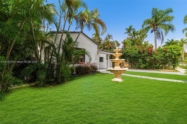 1344 SW 18th St, Miami, FL 33145 - mediterranean / spanish home featuring a front lawn and stucco siding