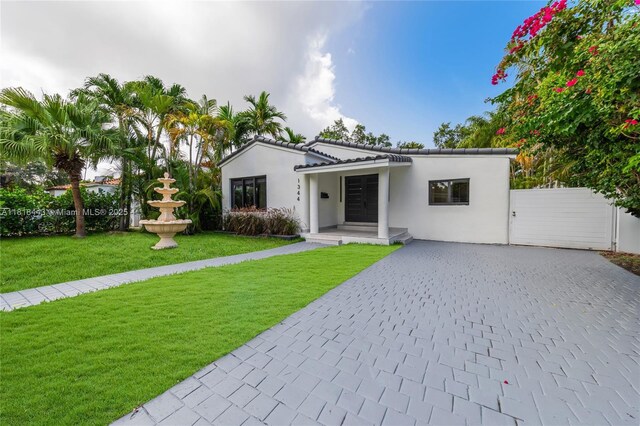 1344 SW 18th St, Miami, FL 33145 - view of grassy yard with outdoor lounge area and a patio area