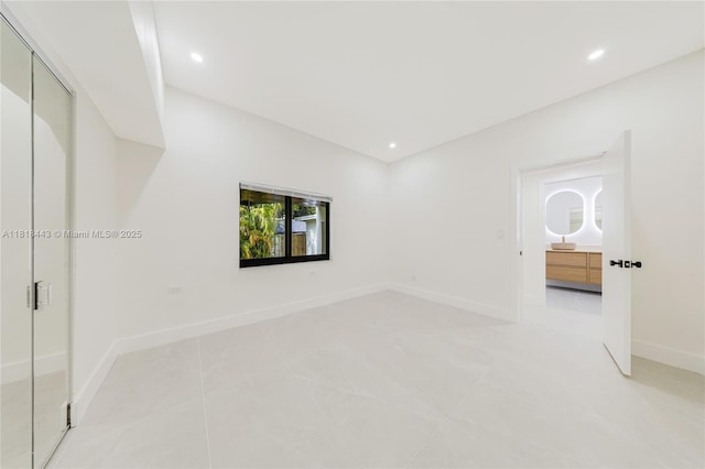 1344 SW 18th St, Miami, FL 33145 - unfurnished bedroom with recessed lighting and light tile patterned floors