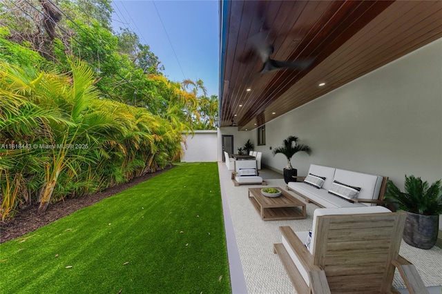 1344 SW 18th St, Miami, FL 33145 - view of green lawn with an outdoor hangout area and a patio area