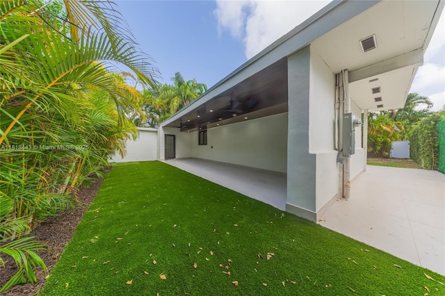 1344 SW 18th St, Miami, FL 33145 - view of grassy yard featuring a patio and ceiling fan