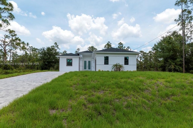 719 Almelia St E, Lehigh Acres, FL 33974 - ranch-style house with french doors