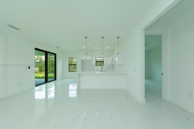 719 Almelia St E, Lehigh Acres, FL 33974 - spare room with light marble finish floors and recessed lighting