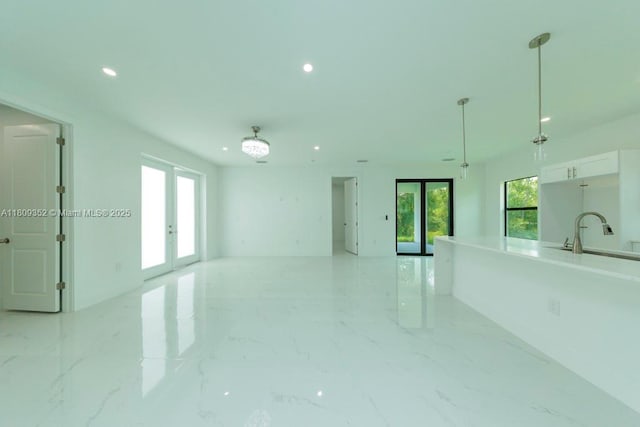 719 Almelia St E, Lehigh Acres, FL 33974 - empty room featuring french doors and recessed lighting