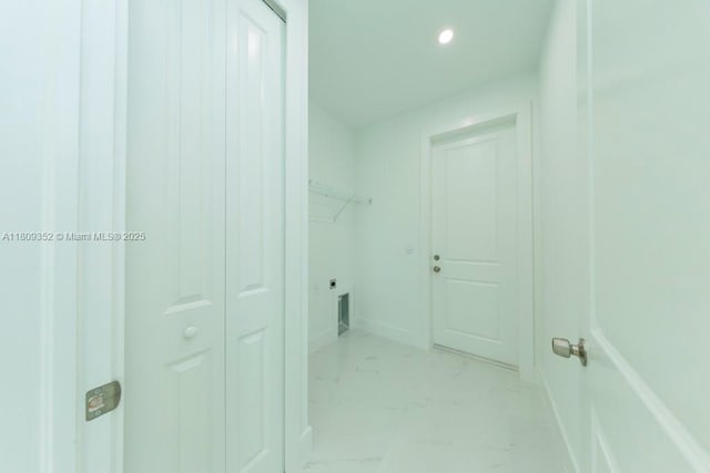 719 Almelia St E, Lehigh Acres, FL 33974 - laundry area with light marble finish floors and recessed lighting