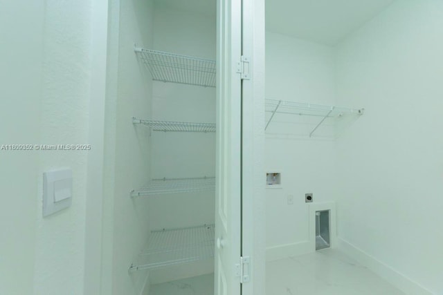 719 Almelia St E, Lehigh Acres, FL 33974 - laundry area featuring washer hookup, hookup for an electric dryer, and marble look tile flooring