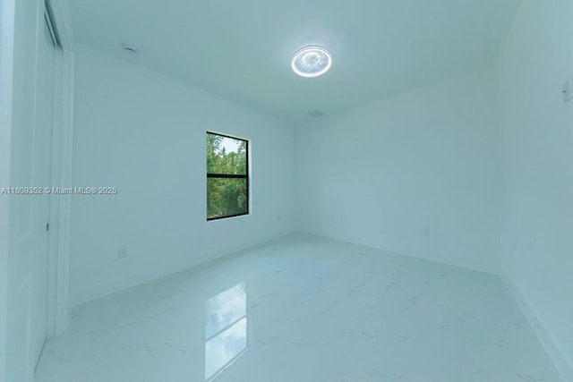 719 Almelia St E, Lehigh Acres, FL 33974 - empty room featuring baseboards