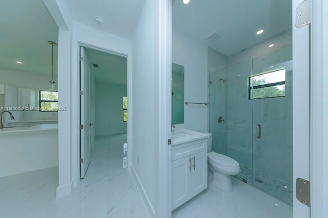 719 Almelia St E, Lehigh Acres, FL 33974 - bathroom featuring a marble finish shower, vanity, marble look tile flooring, plenty of natural light, and recessed lighting