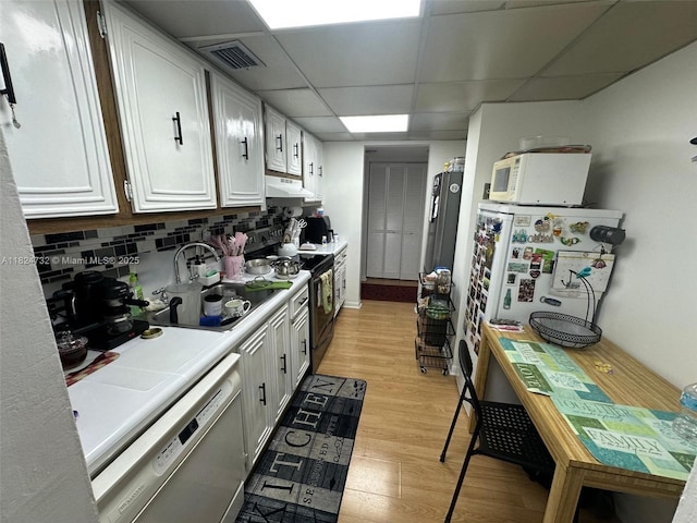 3821 Environ Blvd Unit 407, Lauderhill, FL 33319 - kitchen featuring dishwasher, white microwave, under cabinet range hood, light countertops, and light wood-style floors