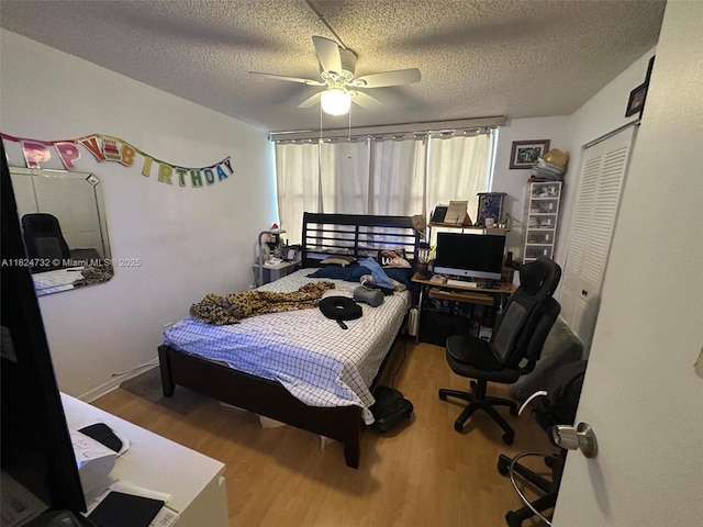 3821 Environ Blvd Unit 407, Lauderhill, FL 33319 - bedroom featuring wood finished floors, a closet, ceiling fan, an office area, and a textured ceiling