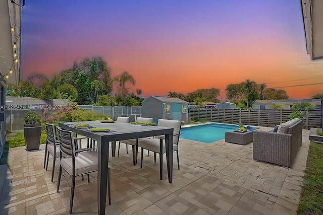 3338 Cleveland St, Hollywood, FL 33021 - view of pool with a patio, a storage shed, a fenced backyard, and outdoor dining space