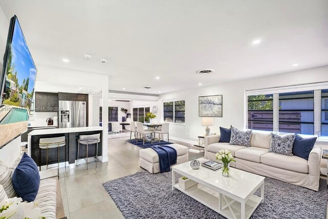 3338 Cleveland St, Hollywood, FL 33021 - living area with recessed lighting, healthy amount of natural light, and light tile patterned flooring