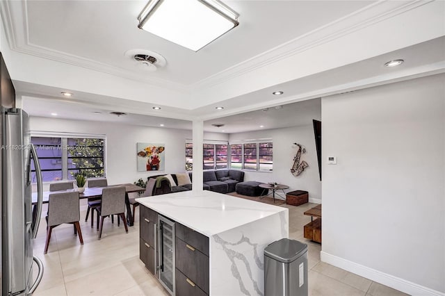 3338 Cleveland St, Hollywood, FL 33021 - kitchen featuring beverage cooler, light tile patterned floors, open floor plan, ornamental molding, and stainless steel fridge