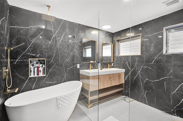 3338 Cleveland St, Hollywood, FL 33021 - bathroom featuring tile walls, double vanity, a freestanding tub, and a marble finish shower