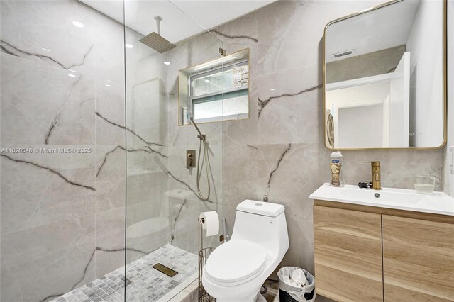 3338 Cleveland St, Hollywood, FL 33021 - full bathroom with tile walls, vanity, and a marble finish shower