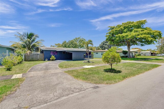 3338 Cleveland St, Hollywood, FL 33021 - view of front of home with asphalt driveway and stucco siding