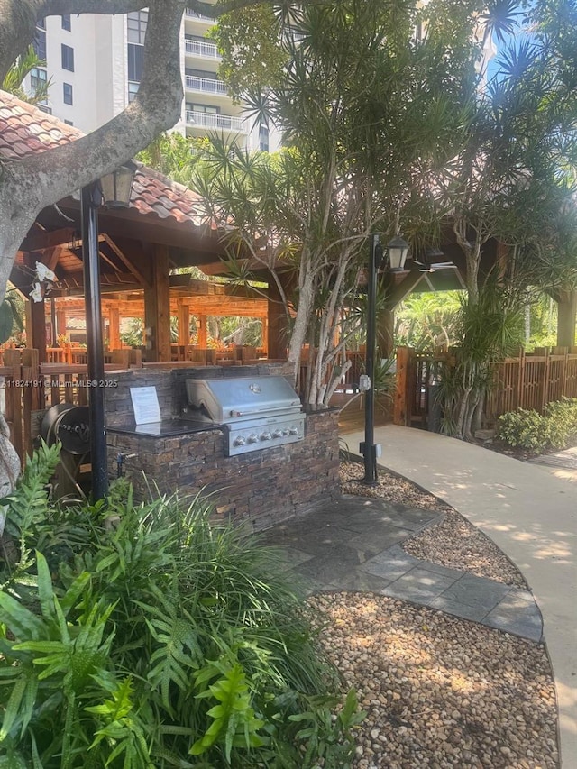 2000 Towerside Ter Unit Ph-3, Miami, FL 33138 - view of patio featuring an outdoor kitchen