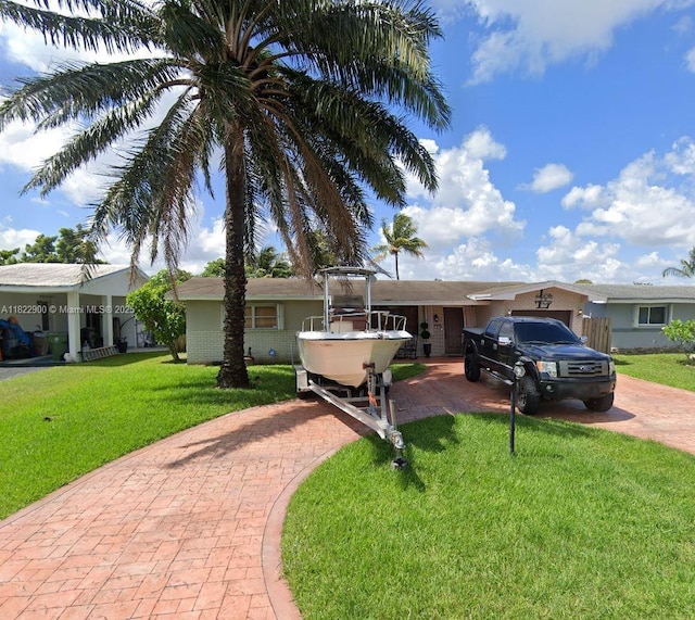 8230 NW 15th St, Pembroke Pines, FL 33024 - single story home featuring decorative driveway and a front yard