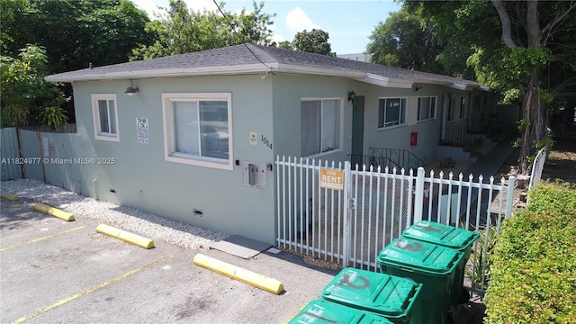 1514 SW 6th St, Miami, FL 33135 - bungalow-style home featuring uncovered parking, a shingled roof, and stucco siding