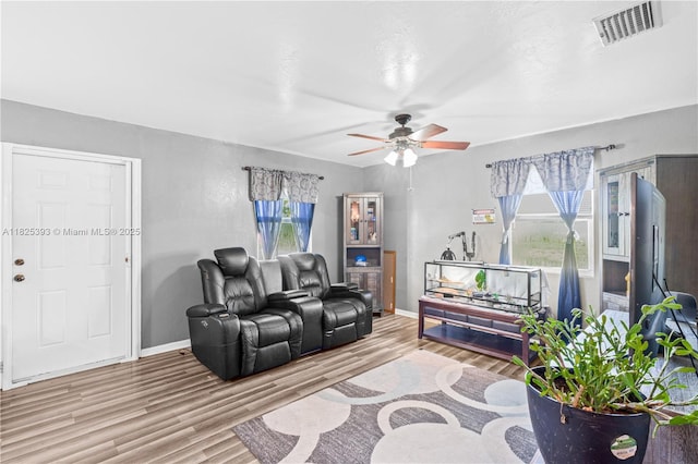 2818 W 66th St, Lehigh Acres, FL 33971 - living room with wood finished floors and a ceiling fan