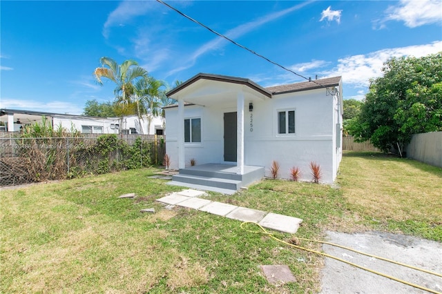 2250 NW 95th Ter, Miami, FL 33147 - rear view of house with stucco siding