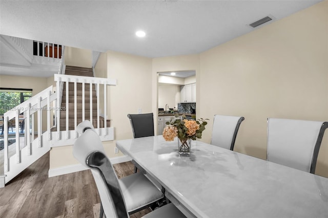 11664 NW 19th Dr, Coral Springs, FL 33071 - dining space with stairs, dark wood-type flooring, and recessed lighting