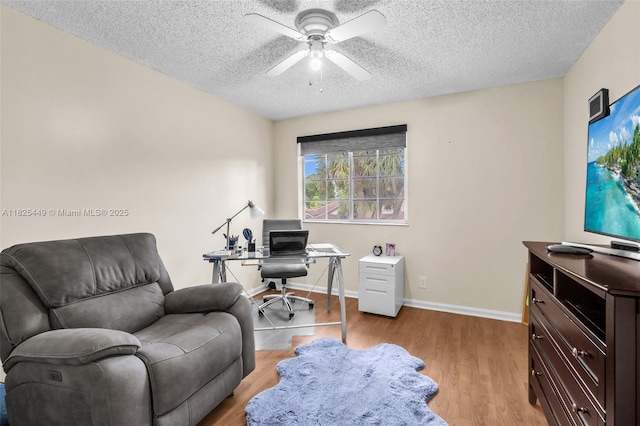 11664 NW 19th Dr, Coral Springs, FL 33071 - office area with light wood-style flooring, a textured ceiling, and a ceiling fan
