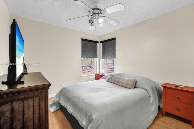 11664 NW 19th Dr, Coral Springs, FL 33071 - bedroom with light wood-style floors, a textured ceiling, and ceiling fan